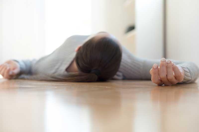 Woman passed out on floor